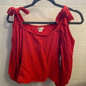 Billabong red long sleeve with shoulder cut outs and bows